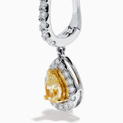 The 18K Two Tone Gold White and Yellow Diamond Drop Earrings feature teardrop-shaped yellow gems encircled by white diamonds, set in two tone gold, with diamond-studded hooks for extra brilliance.