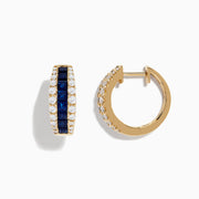 The Royale Bleu 14K Yellow Gold Blue Sapphire and Diamond Hoop Earrings feature a central row of square blue sapphires with round white diamonds on each side, displayed against a plain white background.