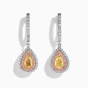 The 18K 3-Tone Gold White, Yellow and Pink Diamond Drop Halo Earrings feature teardrop-shaped yellow gemstones surrounded by pink and white diamonds in a luxurious three-tone gold setting.