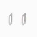 The Pave Classica 14k White Gold Diamond Hoop Earrings feature a thin, sparkling pave surface and are shown against a plain white background.