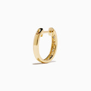The D'Oro 14K Yellow Gold Diamond Huggie Earrings each feature three round white diamonds set vertically and are displayed against a plain white background.