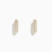 The 14K Yellow Gold Diamond Pavé Dome Mini Hoop Earrings feature rows of sparkling diamonds set in yellow gold, shown on a plain white background.