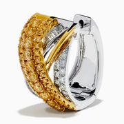 The 14K Two Tone Gold Yellow and White Diamond Crossover Huggie Earrings showcase crisscrossed rows of yellow gemstones and white diamonds, elegantly displayed on a white background.