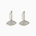 Novelty 14K Yellow Gold Diamond Evil Eye Earrings, featuring eye-shaped designs with sparkling diamonds and a bold circular center, are displayed against a white background.