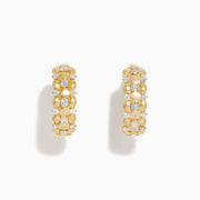 D'Oro 14K Yellow Gold Diamond Huggie Earrings feature a beaded design with clustered round white gemstones along the hoops, shown on a plain white background.