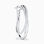 A pair of 14K White Gold Diamond Crossover Hoop Earrings featuring two intertwined, diamond-encrusted lines on each hoop, displayed against a plain white background.
