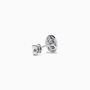 18K Two Tone Gold Pink and White Diamond Halo Stud Earrings feature a central pink stone encircled by a halo of sparkling white diamonds in an elegant circular design.