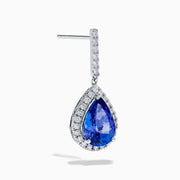 The Nahla 14K White Gold Tanzanite and Diamond Dangle Earrings feature pear-shaped blue Tanzanite gems encircled by diamonds, with a diamond-accented row extending up to the hooks for added elegance.