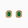 The 14K Yellow Gold Emerald and Diamond Halo Stud Earrings feature rectangular emerald-green stones surrounded by a sparkling diamond halo, set in yellow gold and shown against a white background.