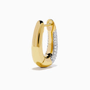 The 14K Yellow Gold Diamond Pave Huggie Hoop Earrings feature a tapered design with sparkling diamonds encrusted on the front, shown against a white background.