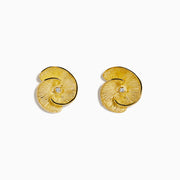 A pair of 14K yellow gold stud earrings featuring a flower design accented with a diamond at the center, displayed on a white background.
