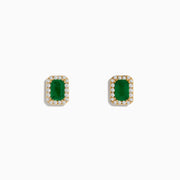 The 14K Yellow Gold Diamond Halo Emerald Stud Earrings feature rectangular emeralds framed by sparkling diamonds, set in yellow gold and shown against a plain white background.