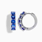 Nahla Siri Sterling Silver 7/8 Hoop Earrings, each featuring five cushion-cut tanzanite stones, displayed on a white background.