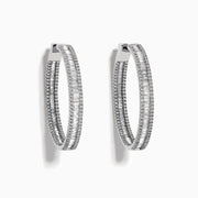 The Pave Classica 14 Karat White Gold Diamond 1.25 Hoop Earrings feature sparkling white diamonds totaling 2.24 TCW, set in elegant oval-shaped hoops and shown against a plain white background.