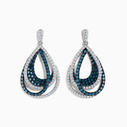 The Bella Bleu 14K White Gold Blue and White Diamond Earrings feature teardrop-shaped dangles with overlapping loops encrusted in blue and white diamonds, showcasing an intricate design against a white gold setting.