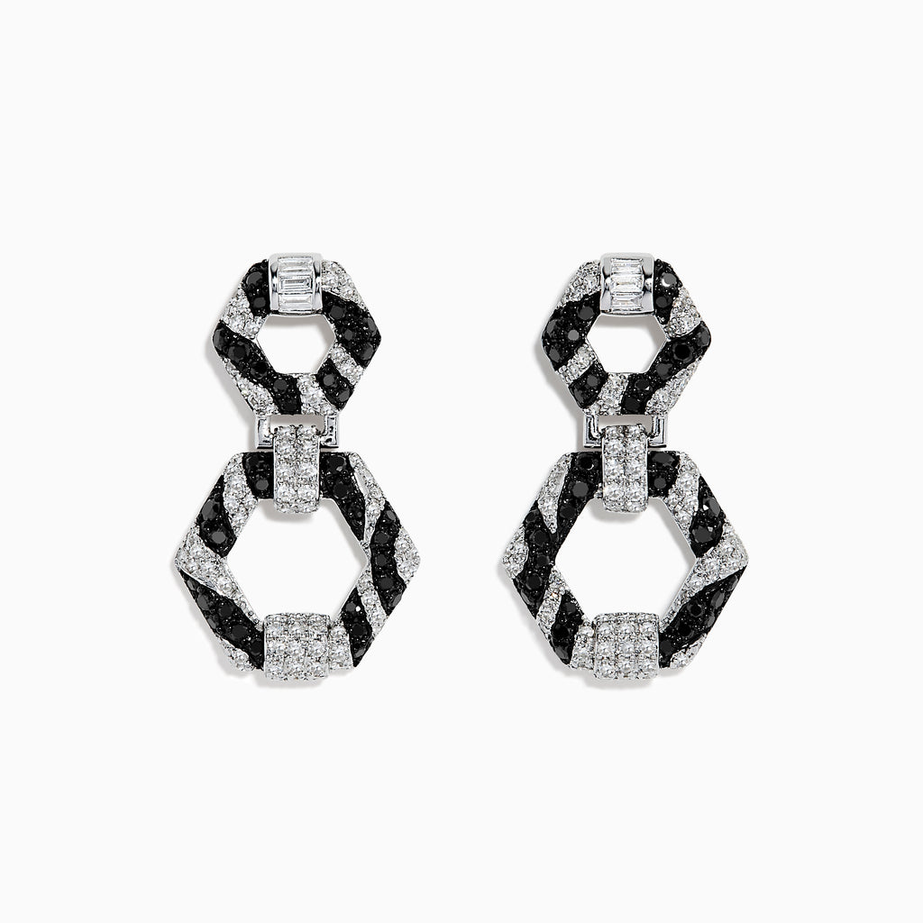 Showcased on a white background, these 14k White Gold Black and White Diamond Zebra Print Earrings feature alternating black and silver hexagonal segments encrusted with sparkling stones.