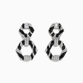 Showcased on a white background, these 14k White Gold Black and White Diamond Zebra Print Earrings feature alternating black and silver hexagonal segments encrusted with sparkling stones.