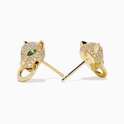 The Signature 14K Yellow Gold Diamond Panther Earrings feature panther heads with green gem eyes, sparkling clear stones, and a gold hoop in each mouth, shown against a white background.