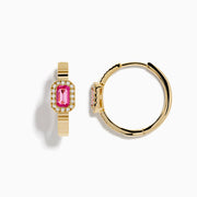 The 14K Yellow Gold Pink Sapphire and Diamond Hoop Earrings feature a rectangular pink sapphire framed by diamonds, crafted in yellow gold and displayed on a plain white background.