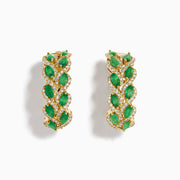 The 14K Yellow Gold Emerald and Diamond Marquise Leaf Hoop Earrings feature alternating marquise emeralds and diamonds in a graceful leaf-inspired design.