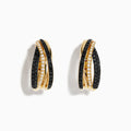 Crafted in 14K yellow gold, these Black and White Diamond Earrings feature an elegant twisted design with intertwined pavé stones, highlighting their sophisticated beauty against a plain white background.