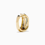 The 14K Yellow Gold Sapphire and Diamond Crossover Hoop Earrings feature intertwined bands set with blue sapphires and small clear diamonds, shown against a white background.