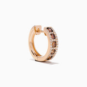 The 14K Rose Gold Brown and White Diamond Hoop Earrings feature a row of round brown and white diamonds in the center, bordered by small clear stones on each side, displayed against a white background.