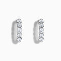 The Classique 14K White Gold Diamond Hoop Earrings feature five round diamonds on each hoop, shown against a white background for a timeless look.