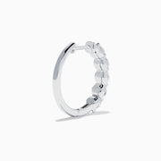 The Classique 14K White Gold Diamond Hoop Earrings feature five round diamonds on each hoop, shown against a white background for a timeless look.