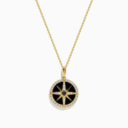 The Novelty 14K Yellow Gold Black Onyx, White and Black Diamond Compass Pendant features a gold chain and round compass design with sparkling stones, shown against a plain white background.