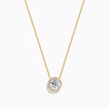 The Star Lab Grown Diamond Halo Pendant in 18K Yellow Gold features a round brilliant lab diamond surrounded by smaller diamonds on a gold chain, displayed against a plain white background.