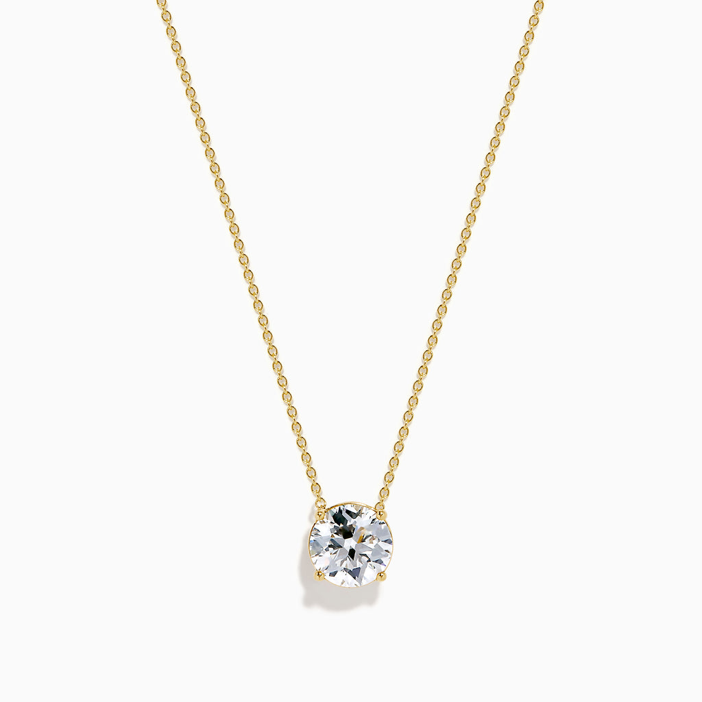 The Star Lab Grown Diamond Solitaire Pendant in 18K yellow gold features a fine chain with a single round lab diamond at the center.