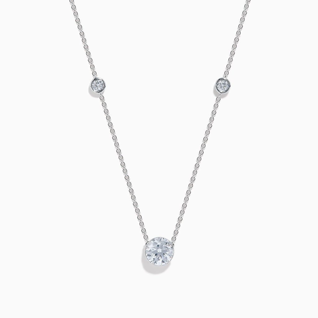 The Star Lab Grown Diamond Necklace in 18K White Gold features three round bezel-set lab diamonds spaced along a silver-like chain, with the largest diamond centered at the bottom for an elegant look.
