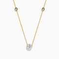 The Star Lab Grown Diamond Necklace in 18K Yellow Gold features a delicate chain with three round, bezel-set diamonds—a larger center diamond and two smaller diamonds evenly spaced along the chain.