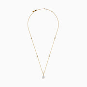 The Star Lab Grown Diamond Classic Station Necklace in 18K yellow gold features a vertical baguette-cut stone, a small round diamond, and a larger round brilliant-cut gemstone pendant.