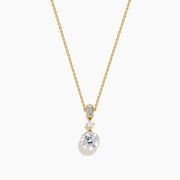 The Star Lab Grown Diamond Classic Station Necklace in 18K yellow gold features a vertical baguette-cut stone, a small round diamond, and a larger round brilliant-cut gemstone pendant.