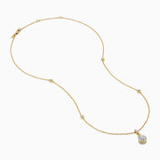 The Star Lab Grown Diamond Classic Station Necklace in 18K yellow gold features a vertical baguette-cut stone, a small round diamond, and a larger round brilliant-cut gemstone pendant.