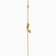 The Star Lab Grown Diamond Classic Station Necklace in 18K yellow gold features a vertical baguette-cut stone, a small round diamond, and a larger round brilliant-cut gemstone pendant.
