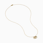 14K Yellow Gold Diamond Accented Interlocking Hearts Necklace featuring two entwined hearts—one with sparkling diamonds, the other polished smooth—shown on a plain white background.