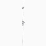 The 18K Two-Tone Gold Pink and White Diamond Pendant showcases a teardrop design with concentric pink and white diamonds, hanging from a chain elegantly accented with small round gems.