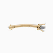 A 14K Yellow Gold 1.5-Inch Collar Necklace Extension, with a sleek curved shape and ornamental clasp, evocative of fine jewelry design, showcased on a white background.