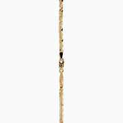 The 14 Karat Yellow Gold Cleo Link Necklace, showcasing a shiny, textured surface and elegant chain design, is displayed against a plain white background.