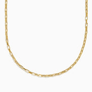 The 14K Yellow Gold Hollow Rectangle Link Necklace features delicate, elongated rectangular links and is shown curved gently against a white background, emphasizing its simple, elegant design.