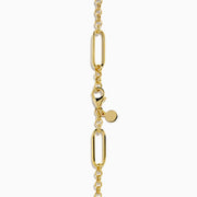 The 14K Yellow Gold Elongated Paperclip Chain Y-Necklace with Toggle Bar showcases large oval links and a vertical bar pendant, creating a sleek and modern Y-necklace design.