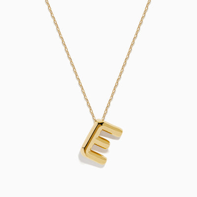 The 14K Yellow Gold Initial E Bubble Pendant sits on a thin chain, showcasing a bold, modern look against a plain white background.