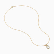 The DOro 14K Yellow Gold Diamond Pendant features a teardrop-shaped diamond accented with sparkling white stones, hanging on a delicate gold chain and set against a plain white background.