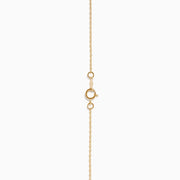 The DOro 14K Yellow Gold Diamond Pendant features a teardrop-shaped diamond accented with sparkling white stones, hanging on a delicate gold chain and set against a plain white background.