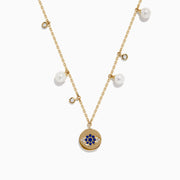 14K Gold Fresh Water Pearl, Sapphire and Diamond Evil Eye Necklace featuring a round blue and white evil eye pendant, accented with pearls and sparkling charms on a gold chain, shown against a white background.