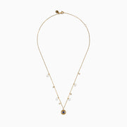 14K Gold Fresh Water Pearl, Sapphire and Diamond Evil Eye Necklace featuring a round blue and white evil eye pendant, accented with pearls and sparkling charms on a gold chain, shown against a white background.