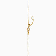 The 14K Yellow Gold Garnet and Diamond Halo Heart Pendant Necklace features a deep red garnet heart framed by a sparkling diamond halo on a yellow gold chain.